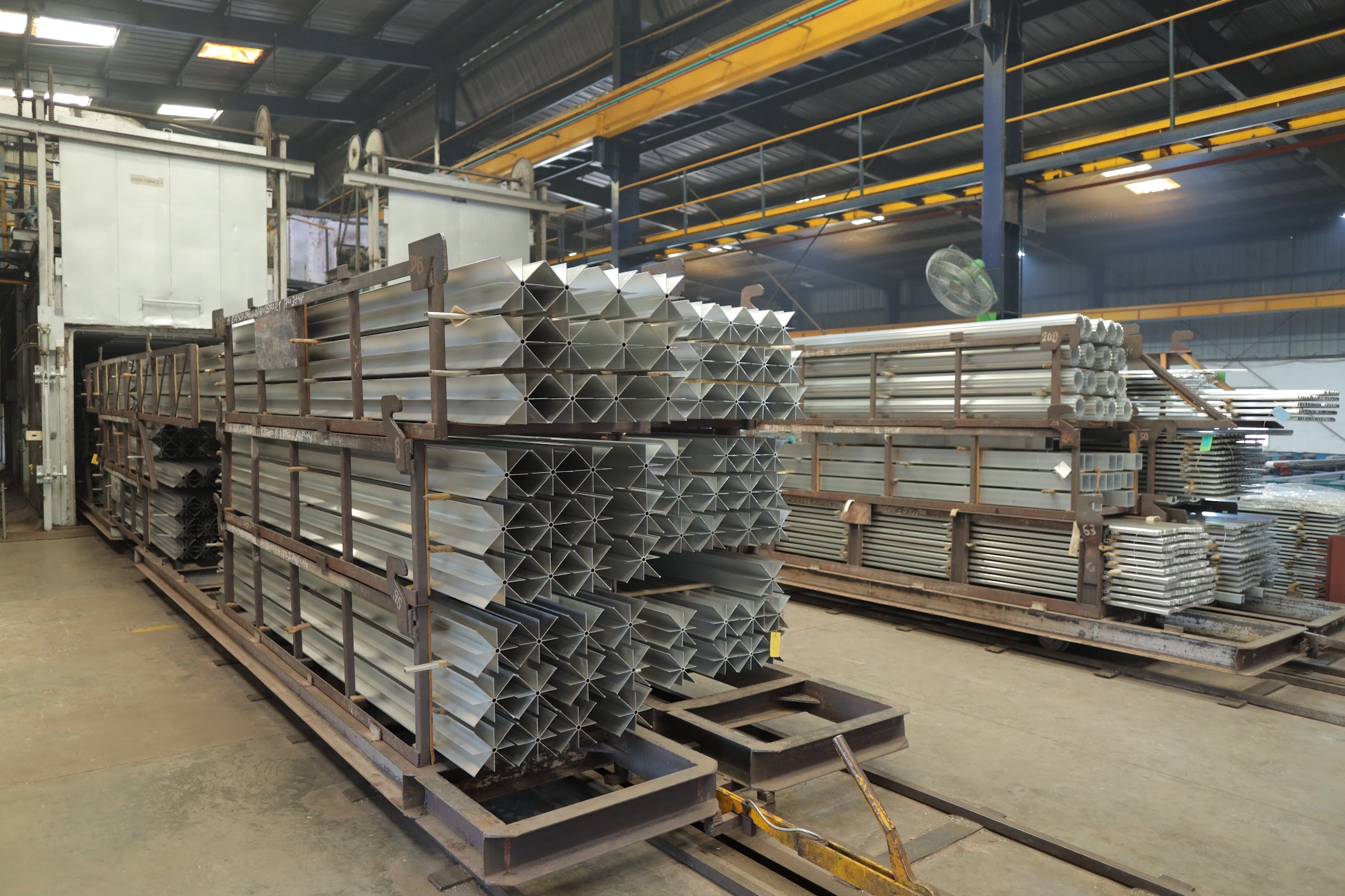 Banco Aluminium ageing furnace with loaded charge racks of extruded profiles